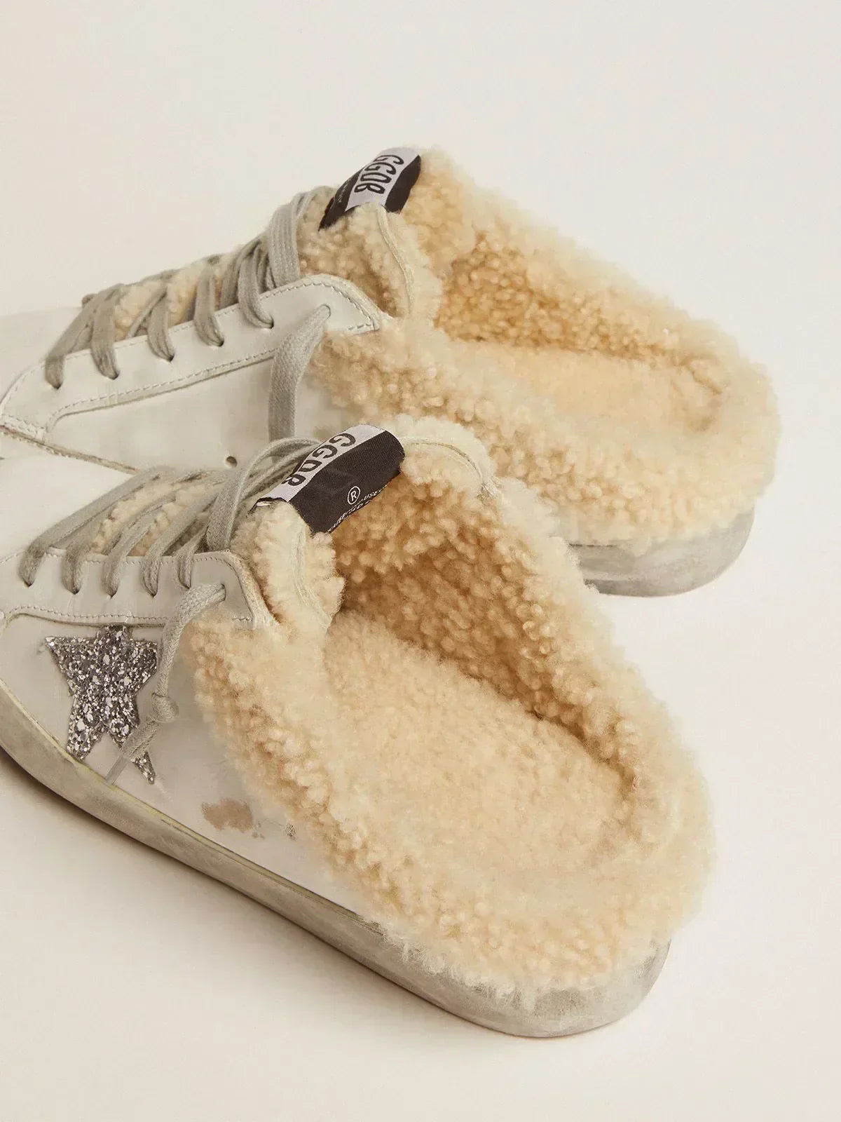 Super-Star Sabots in white leather with silver glitter star and shearling lining