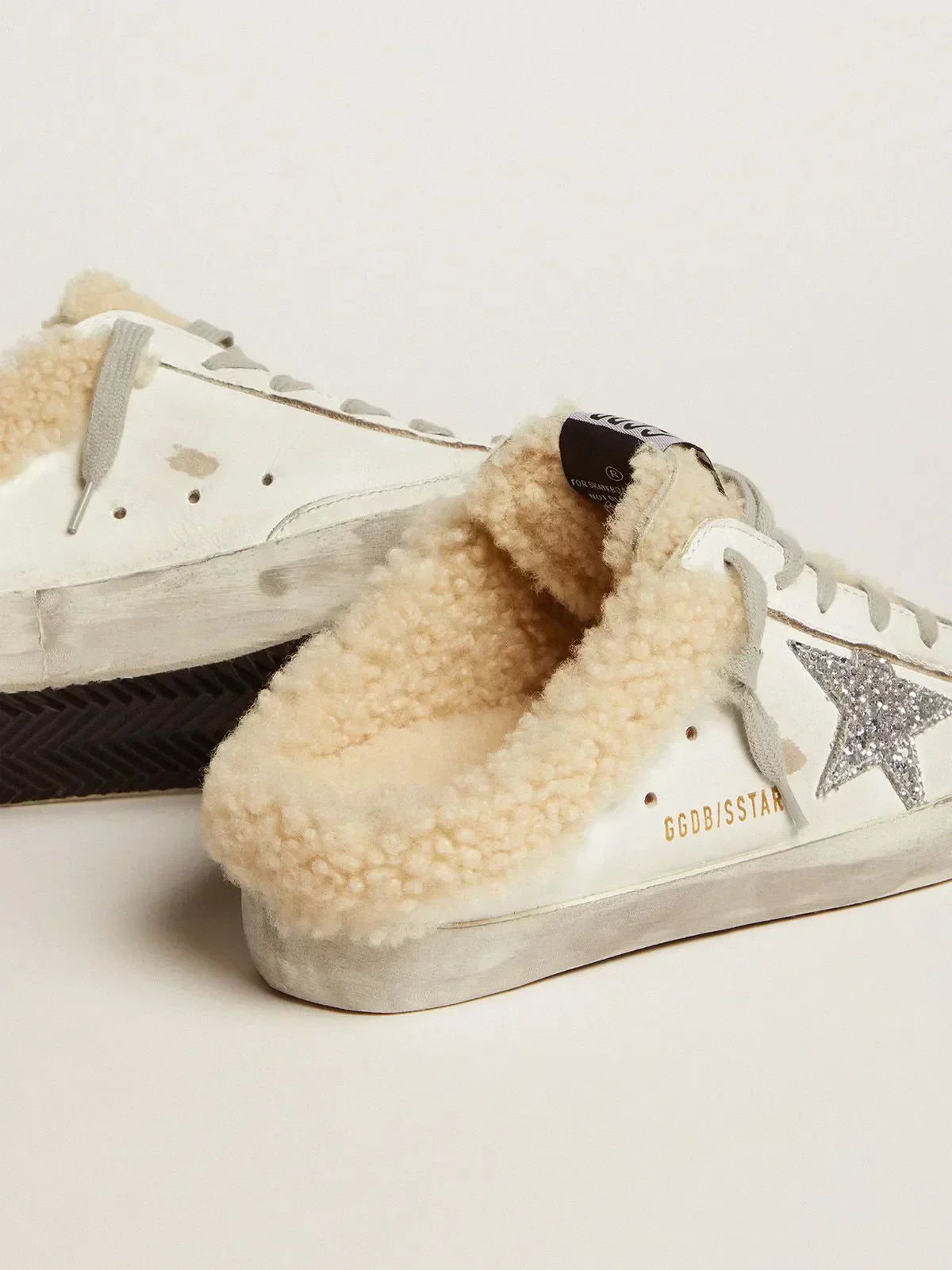 Super-Star Sabots in white leather with silver glitter star and shearling lining