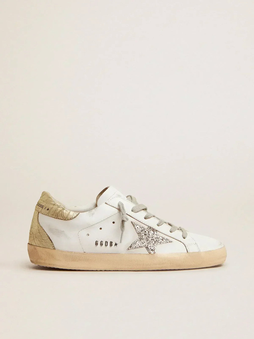 Super-Star sneakers with silver glitter star and glossy gold leather heel tab