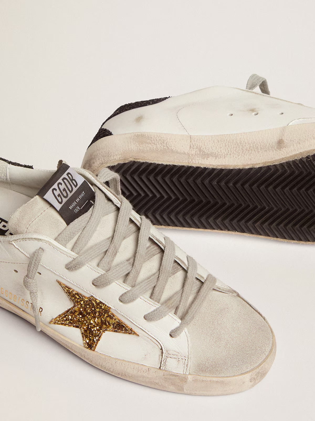 Women's Super-Star LTD with gold star and black glitter heel tab