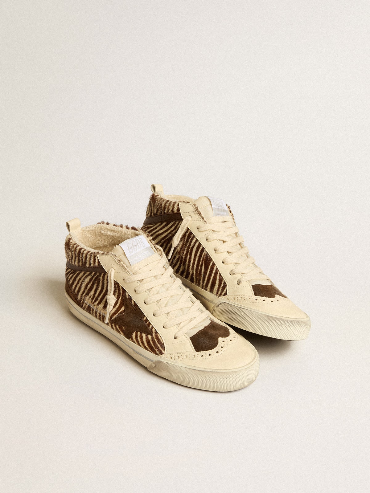 Mid Star LTD in zebra-print pony skin with suede star and brown flash