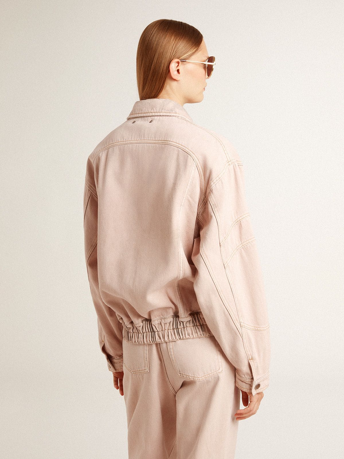 Women's pink dyed denim bomber jacket