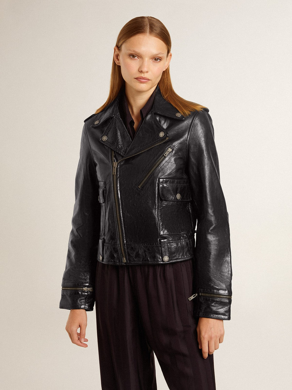 Women's black leather biker jacket with glossy effect