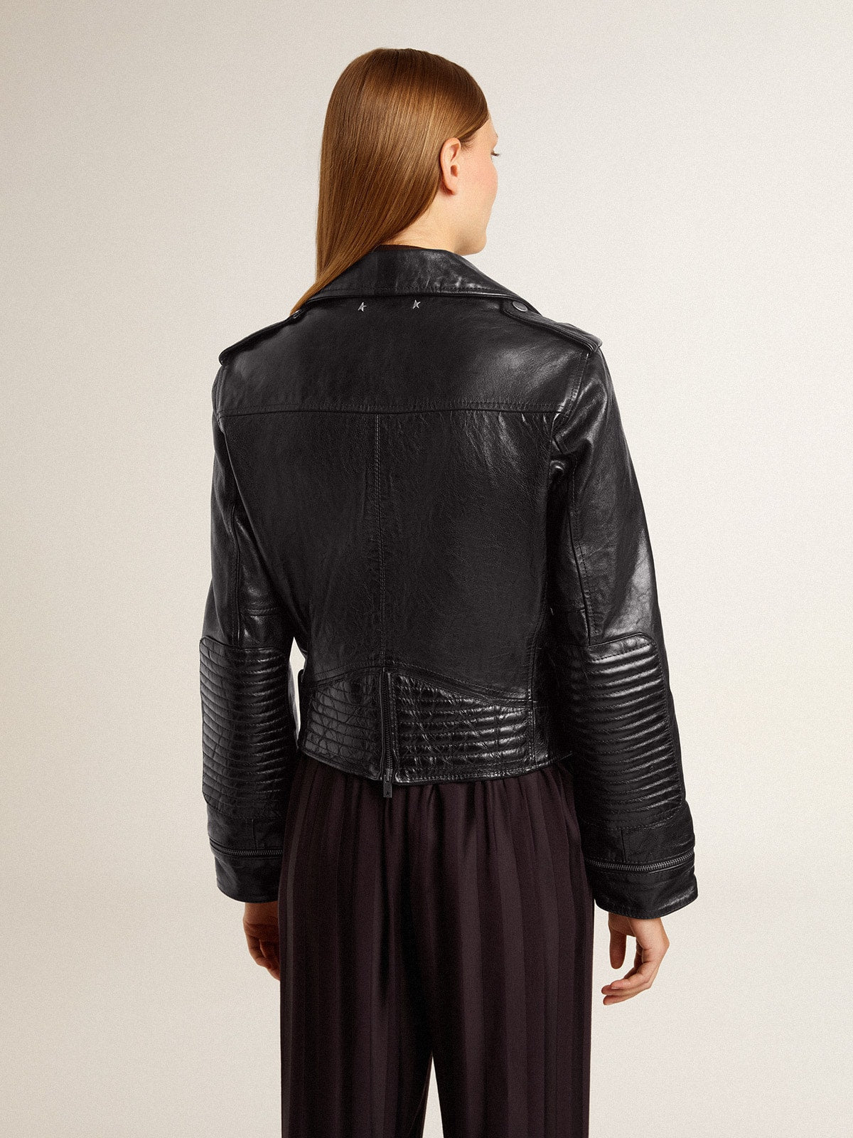 Women's black leather biker jacket with glossy effect