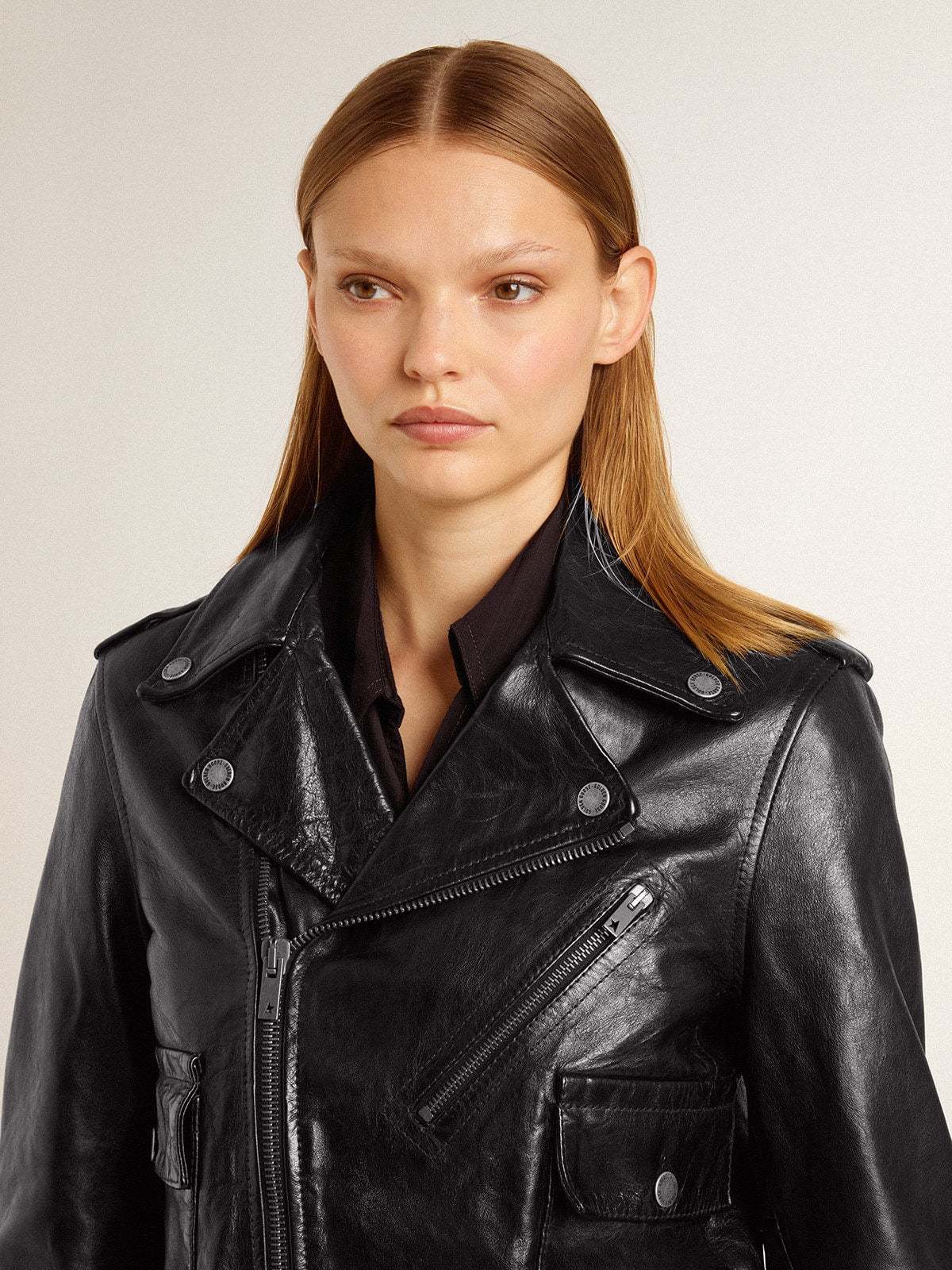 Women's black leather biker jacket with glossy effect